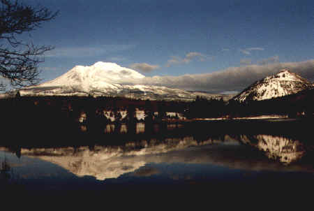 Panorama — lake reflecting snow-covered mountain